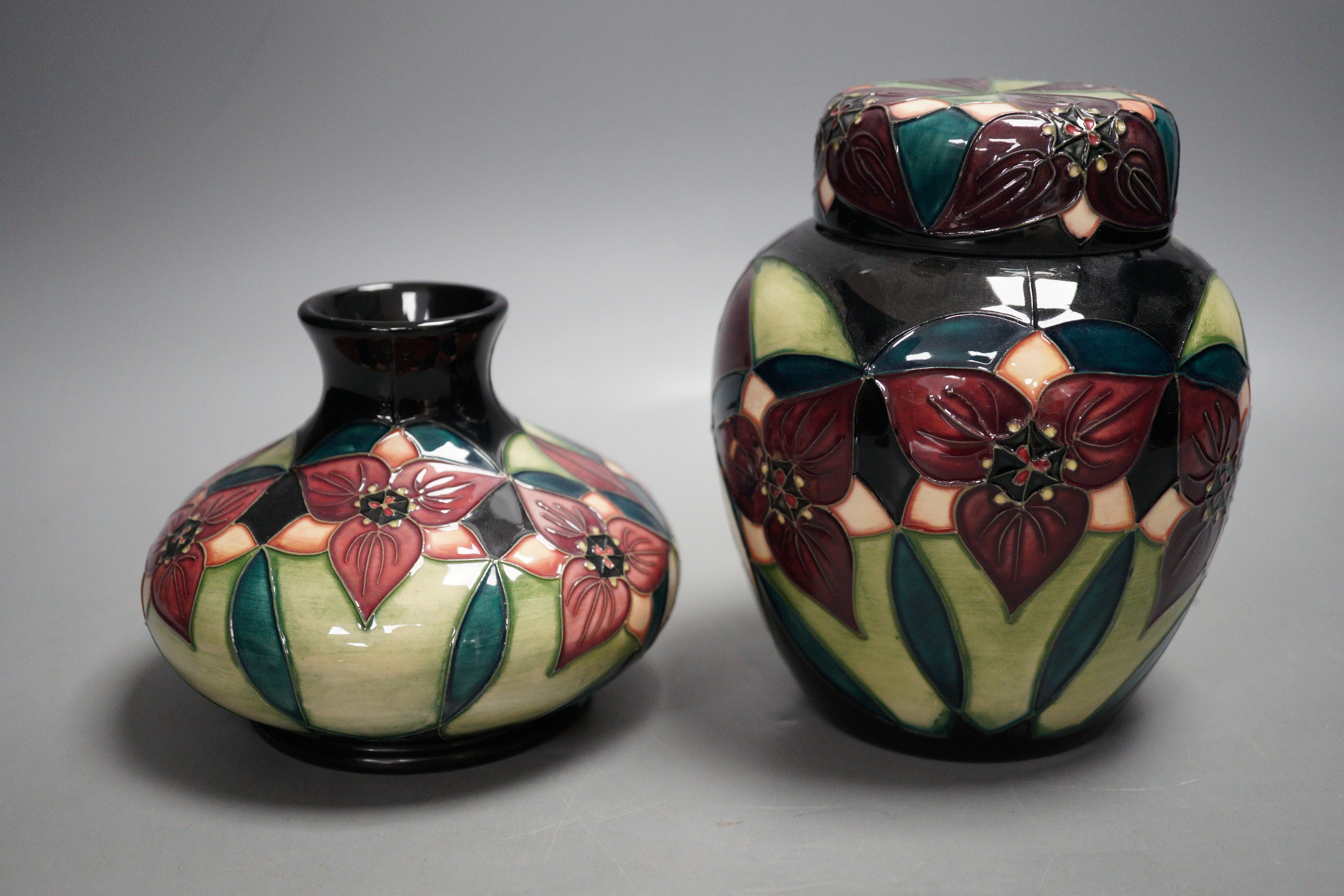 A Moorcroft pottery squat shaped vase and lidded ginger jar, decorated in the 